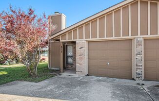 Modern duplex featuring three bedrooms and two bathrooms with an attached garage.