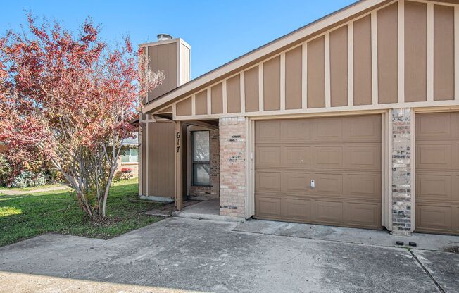 Modern duplex featuring three bedrooms and two bathrooms with an attached garage.