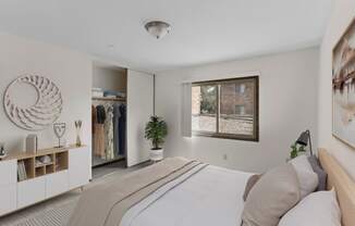 a bedroom with a large bed and a window