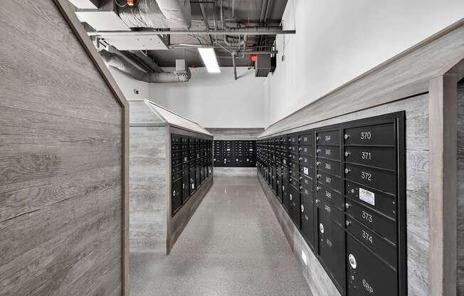 A long hallway with a series of lockers on the right side.