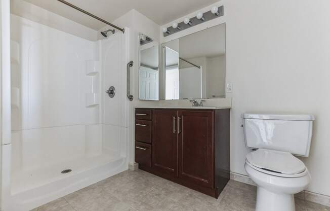 an empty bathroom with a toilet and a sink