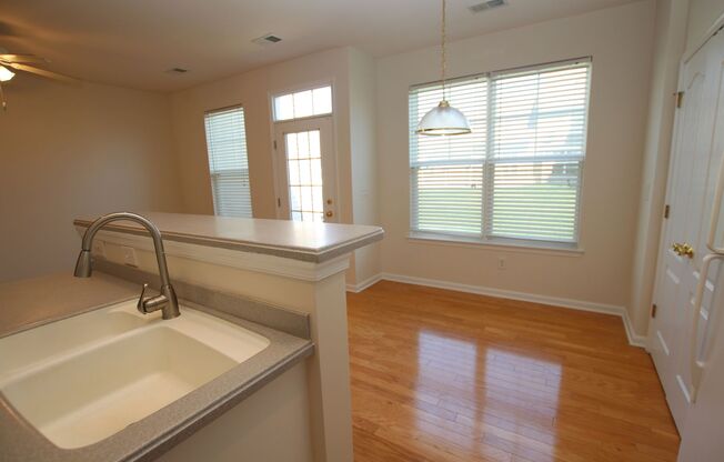 Modern and spacious town home with community pool.