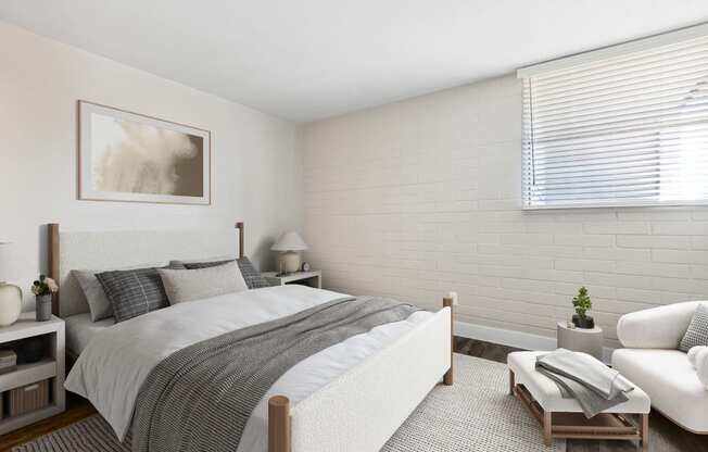 Model Bedroom with Wood-Style Flooring and Window View at Arcadia on 49th Apartments located in Phoenix, AZ.