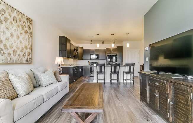 a living room with a couch a table and a tv