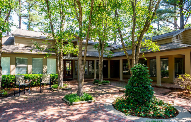 the front of a house with trees and a courtyard at The Summit Apartments, Tennessee