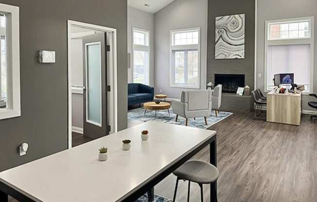 an open living room and dining room with a white table