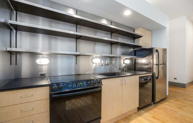 a kitchen with stainless steel appliances and wooden cabinets