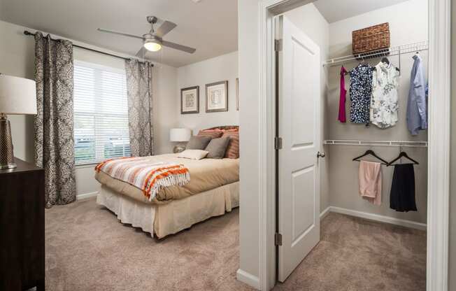 Bedroom and closet at Abberly Market Point Apartment Homes, South Carolina, 29607
