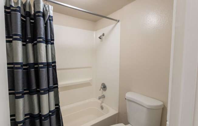 This is a photo of the primary bathroom in the 965 square foot 2 bedroom, 2 bath  apartment at Harvard Square Apartments, in Dallas, TX.