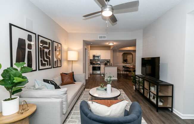 an open living room and kitchen with a ceiling fan at Willowest in Lindbergh, Atlanta