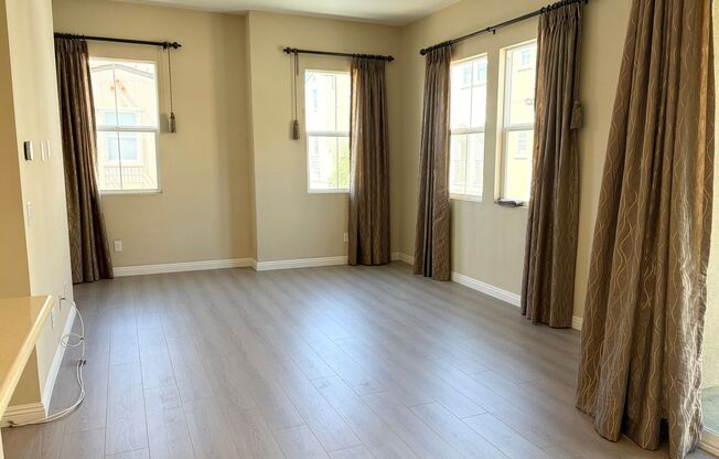 Stylish 3-Story Townhome with Balcony & Open-Concept Living