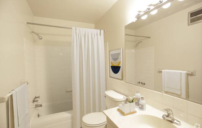 Bathroom showing a vanity, towel bar, sink, toilet, full  bath and shower.