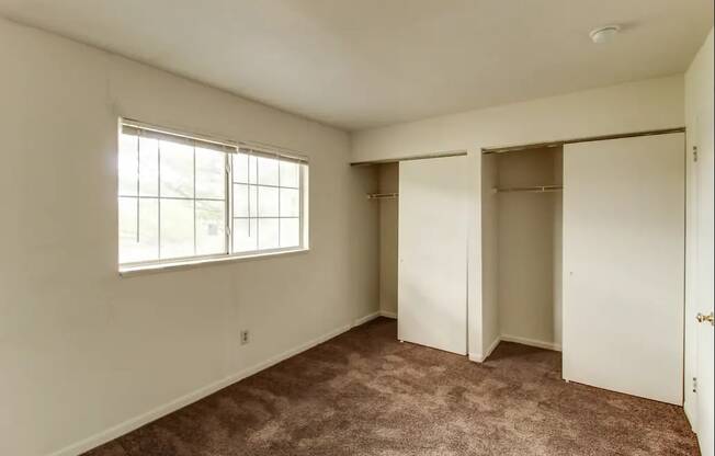 Vacant Bedroom with large closets at Arbor Pointe Townhomes, Battle Creek, Michigan