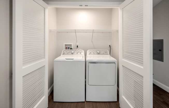 a laundry room with two washes and a dryer in it