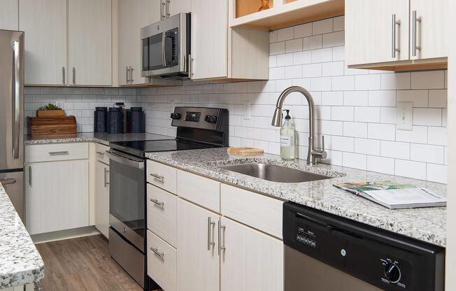 a kitchen with a sink and a counter top