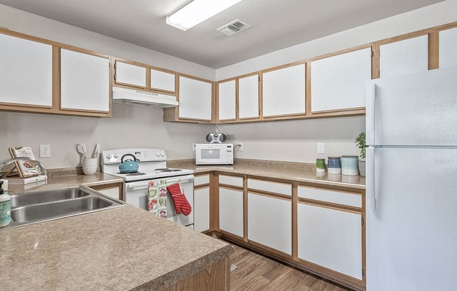 Kitchen with microwave at Villas at Bailey Ranch Apartments, Oklahoma, 74055