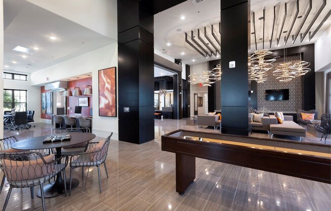a living room with a pool table and a dining room at North Creek, Texas