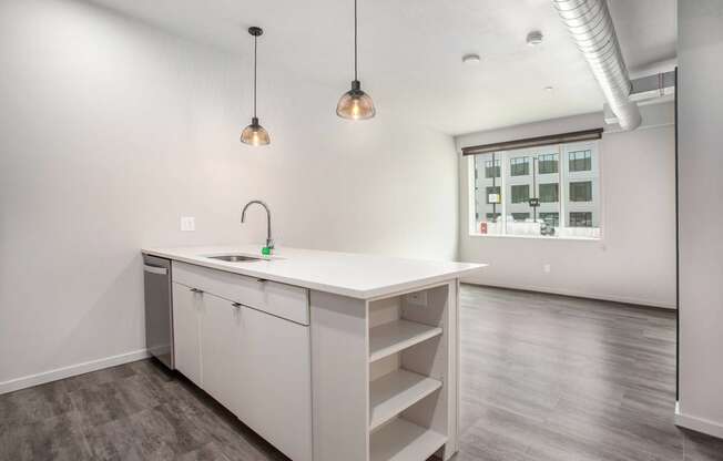 234 Market Apartments In Grand Rapids, MI With Renovated Kitchens featuring a quartz countertop island