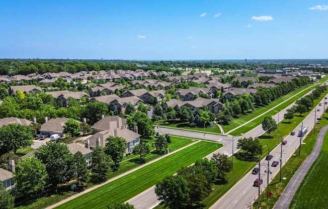 A suburban neighborhood with houses and a road.