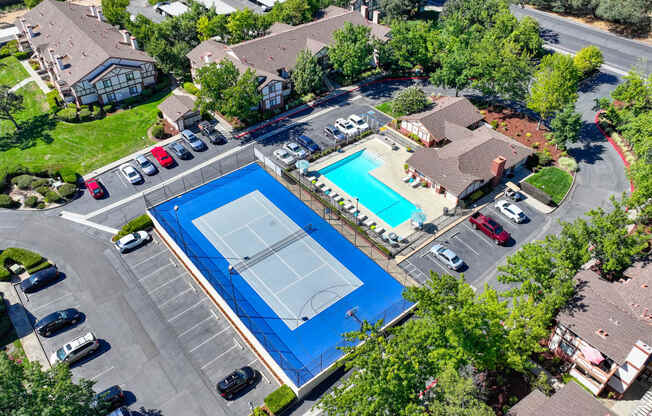 Drone shot of the Rocklin Manor sports court and the swimming pool and leasing office building.