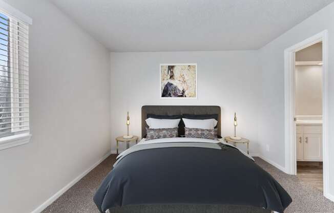 a bedroom with a bed and a window  at Eastwood Crossings, Kansas City, Missouri