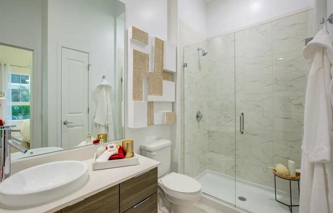 a bathroom with a sink toilet and shower at Altis Grand Central, Tampa, 33606