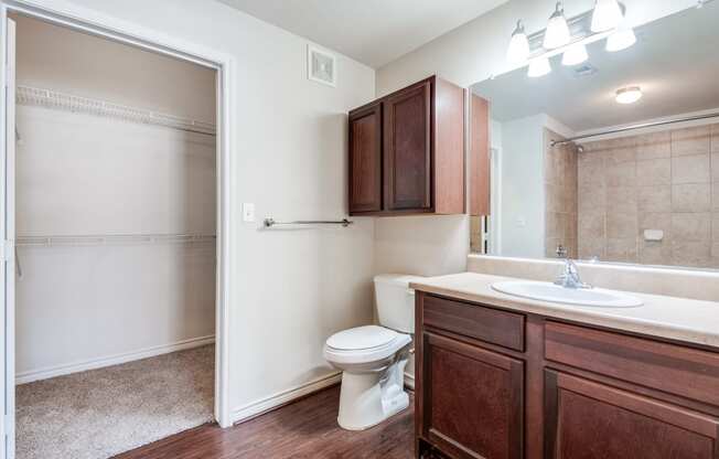 an empty bathroom with a toilet and a sink