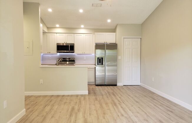 Ground Level Condo; Private Driveway; Corner Unit; Outdoor Space; Quiet Street