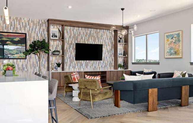 A living room with a television, a sofa, and a coffee table.