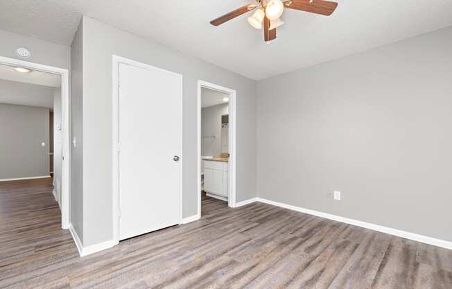 Bedroom with closet door and bedroom door at Eddingham in Lawrence, KS