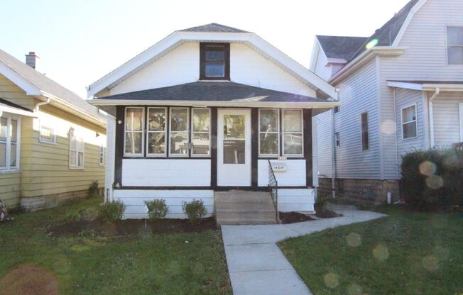 3 bedroom 1 bath West Allis home with granite counters and 2 car garage