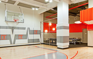 45 Wall St Apartments amenity Gym features a Half Basketball Court with table tennis in adjacent clu