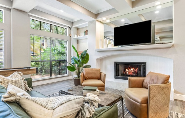 a living room with a fireplace and a television