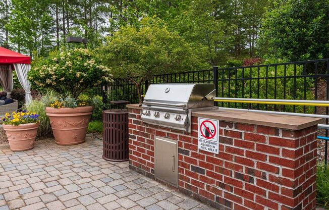 a barbecue grill with a no smoking sign on it