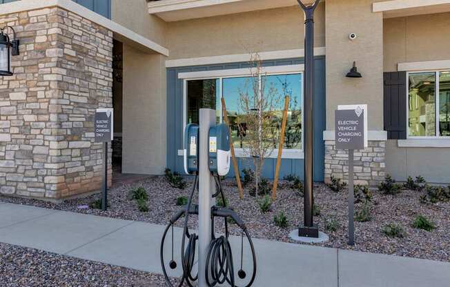 A bicycle is parked next to a charging station for electric vehicles.