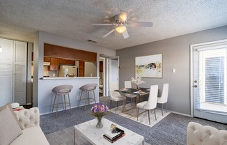 living room, dining area, and breakfast bar space in apartment