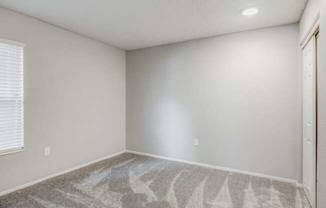 bedroom with upgraded carpet at The Life at Highland Village, Missouri, 64129