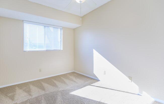 a bedroom with a large window