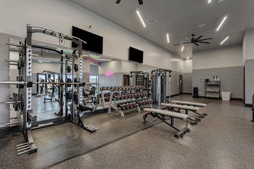a gym with weights and dumbbells and other exercise equipment at SevenO2 Main Apartments, Salt Lake City, 84101