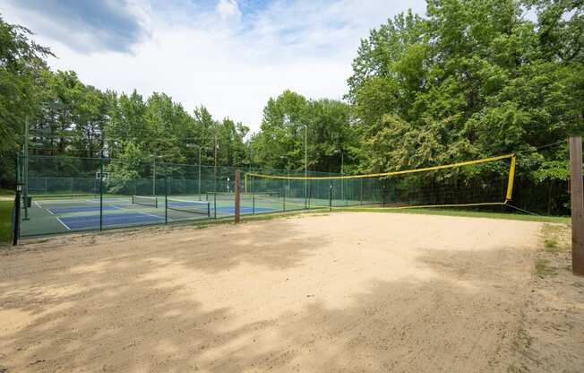 View of sand volleyball court with tennis, basketball, and pickleball ball court in background