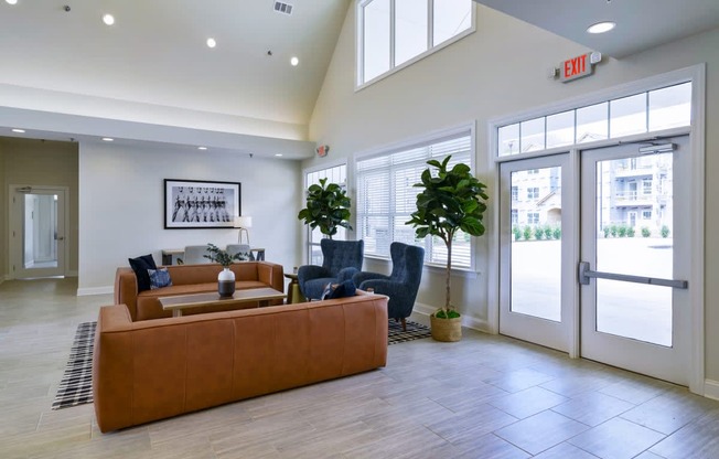 Ashland Farms Resident Clubhouse with Couch Seating, Modern Decor, and View of Pool Area