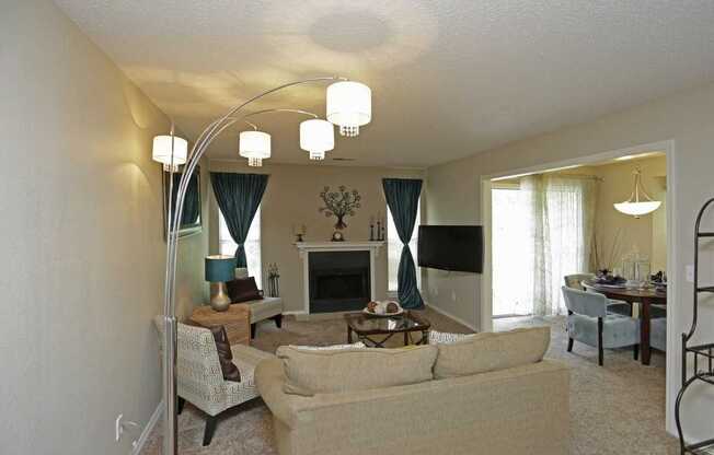 a living room filled with furniture and a fire place