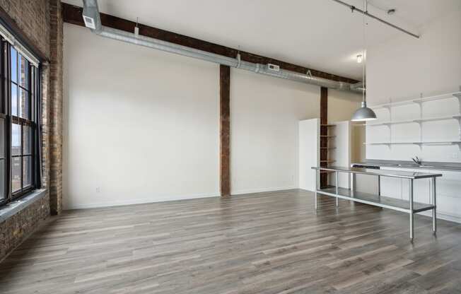 an empty room with white walls and wood floorsat Gaar Scott Historic Lofts, Minneapolis, 55401