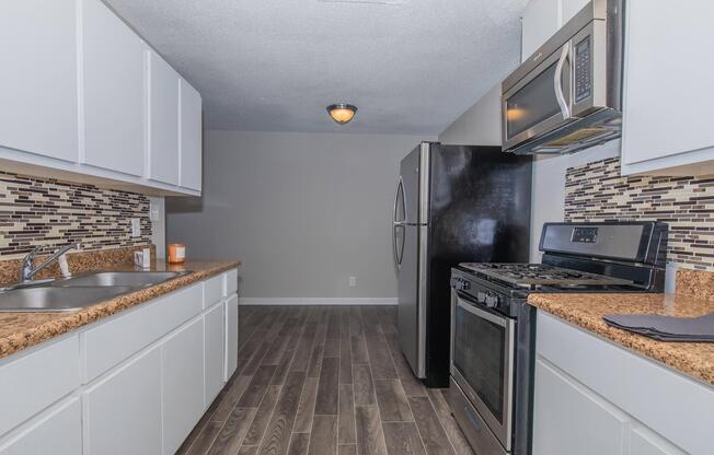 a modern kitchen with stainless steel appliances