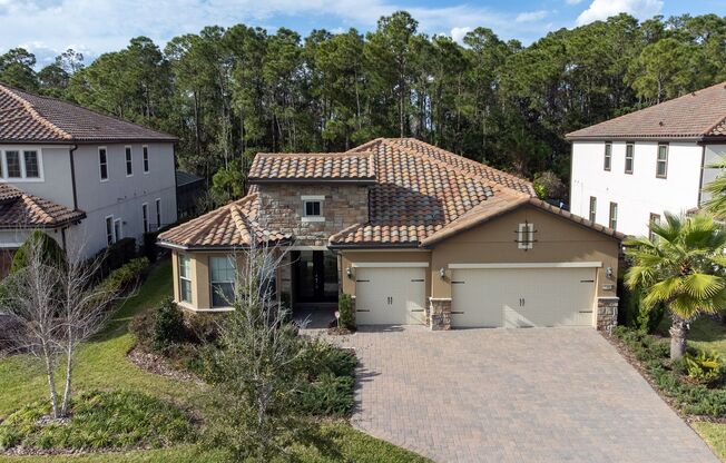 UNIQUE HOME WITH CONSERVATION at Enclave at Lake Nona. This gorgeous 3 bedroom, 3 bathroom home PLUS DEN + 3 cara garage