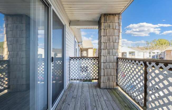 the deck has a view of the neighborhood and the sky