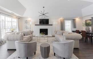 A modern living room with a fireplace and a television.