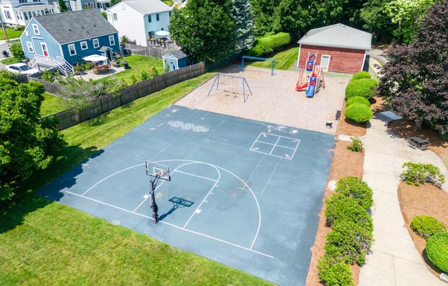 an aerial view of a basketball court and playground