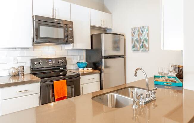 Kitchen with Silver Appliances at San Tropez