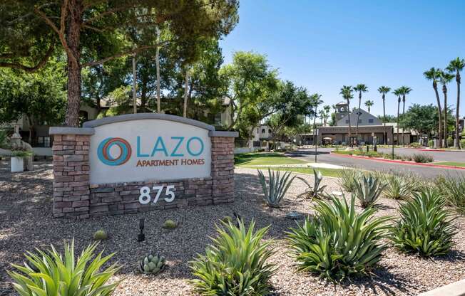 a sign with for lazo apartment homes logo